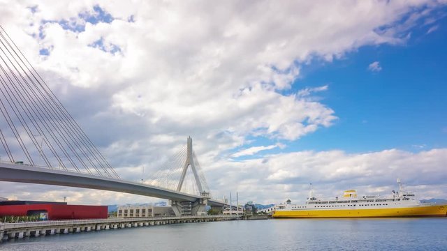 Timelapse of Aomori Bay in Japan with bay bridge and cloud flowing on beautiful sky
