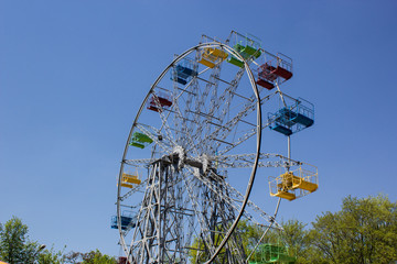 Multicolored Ferris Wheel with blue sky as background