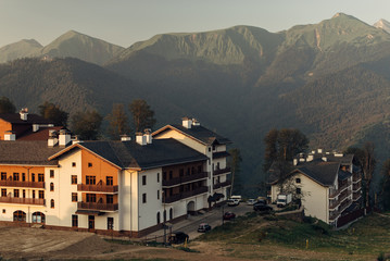 Fototapeta na wymiar Hotels in the mountains at sunset