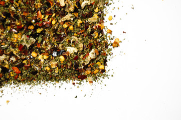 Mixed organic spices on white background. Garlic fennel carrots basil celery, parsley, marjoram, onion.