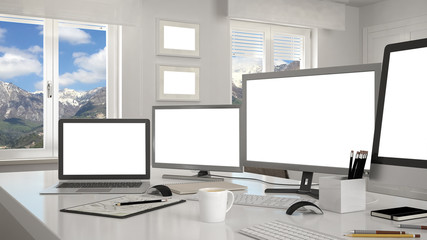 White workplace with computers on a desk