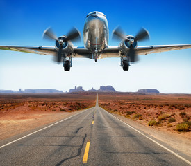 airplane over a road