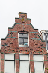 Fototapeta na wymiar Traditional view of buildings roofs in Holland
