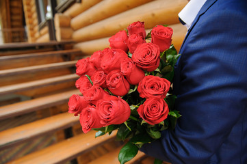 Man with a large bouquet of roses