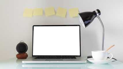 Laptop, lamp and coffee cup on a table, working area, moderm interior desin