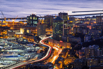 Fototapeta premium GENOA, ITALY, OCTOBER 27, 2016 - Aerial view of Genoa, Italy, the harbor with the causeway by night / Genoa, October 27, 2016 Italy, Europe