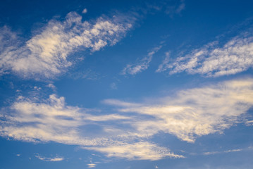 blue sky background with tiny clouds