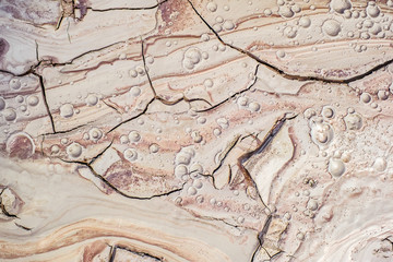 Detail of dried mud volcanoes's clay river, closeup view.