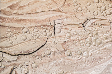 Detail of dried mud volcanoes's clay river, top view.