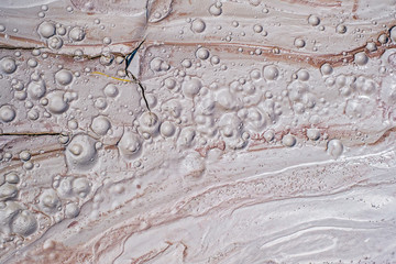 Detail of dried mud volcanoes's clay river, top view.