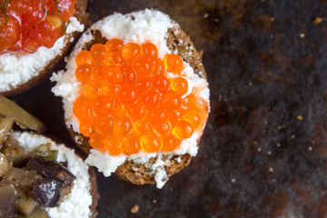 Bruschetta with ricotta cheese and red caviar