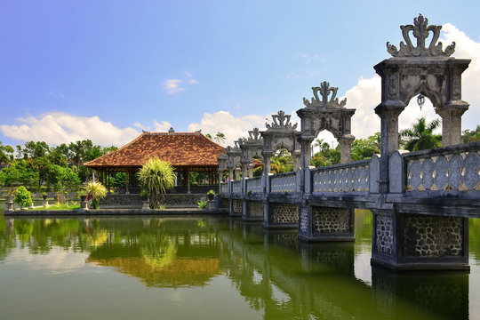 Bali, Indonesia. View of the Taman Ujung Water Palace, surrounded by a pond and garden
