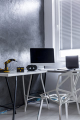 Interior with home office area on cyan wall