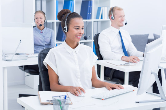 Team of businesspeople with headsets
