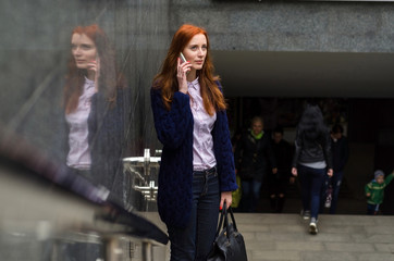 Young woman using her cell phone 