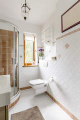 Bathroom interior with white tiles