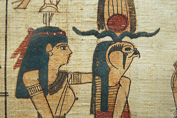 Egyptian Hieroglyphs closeup Ra  on papyrus