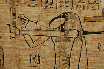 Egyptian scribe Hieroglyph closeup on papyrus - obrazy, fototapety, plakaty