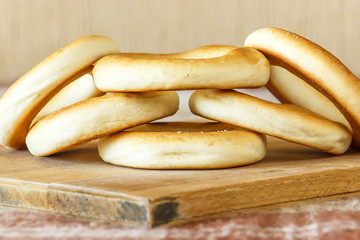 National Russian bagels on a wooden board and  plaid