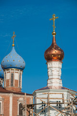 Domes of ortodox church over the blue sky, Russia, Ryazan Kremlin.