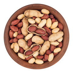 Peanuts in a brown plate. Isolated on white background.