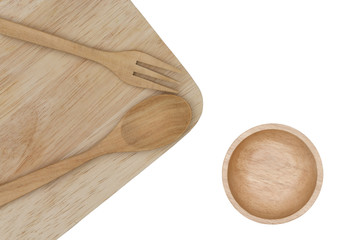 spoon and fork on cutting board with cup