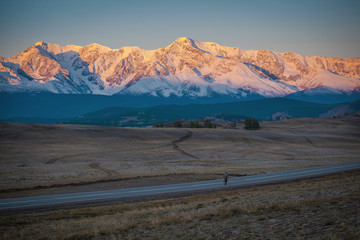 Wooden fence in snow covered mountains