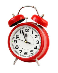 Red retro alarm clock at twelve o'clock, isolate.