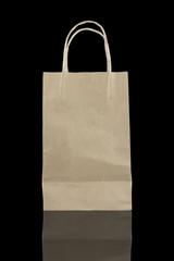 disposable paper bag isolated on black background