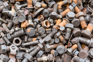 Old and used nuts and bolts on dirty and grunge cement floor