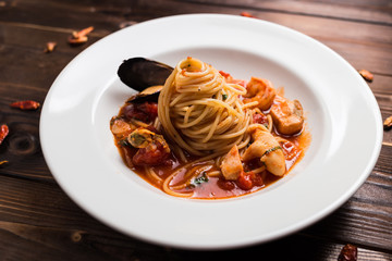 Seafood spaghetti on white plate