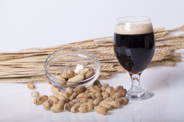 Black beer in the glass on the table