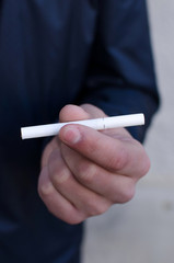 Young man smoking cigarette 