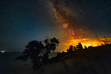 Milky Way is illuminated by the glow of sunset.