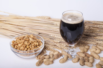 Black beer in the glass on the table