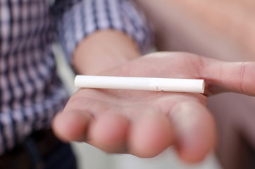 Young man smoking cigarette 