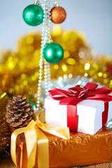 Gold Christmas background of de-focused lights with decorated tree