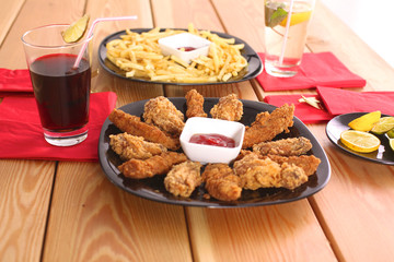 Grilled chicken on a plate standing the wooden table