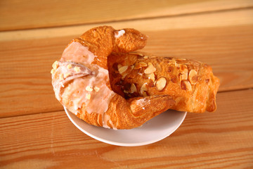 Croissant in the plate on the table