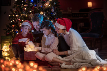 At christmas a lovely family find a digital tablet in their gift
