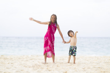 Happy Girl and Boy Playing at the beach