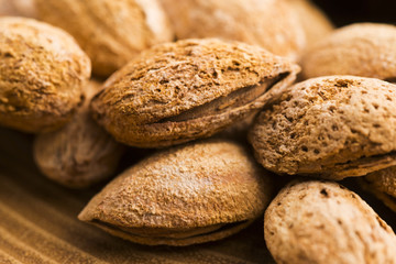 Heap of almond nuts in shell