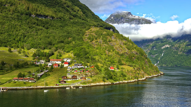Ship approach to the village of Geiranger at the headwaters of the beautiful Geiranger Fiord in Norway