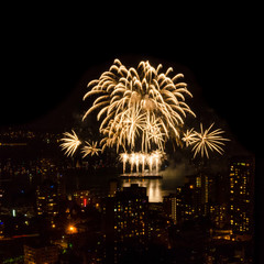 Fireworks over beautiful night city view in Vancouver, Canada.