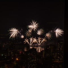 Fireworks over beautiful night city view in Vancouver, Canada.