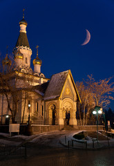 Fototapeta na wymiar Russian Church by night with moonrise