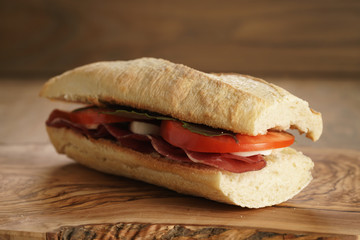 homemade italian sandwich with bresaola and mozzarella