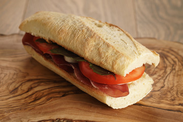 homemade italian sandwich with bresaola and mozzarella