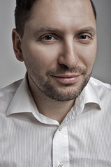 Obraz premium portrait of the unshaven self-assured man,quiet balanced look