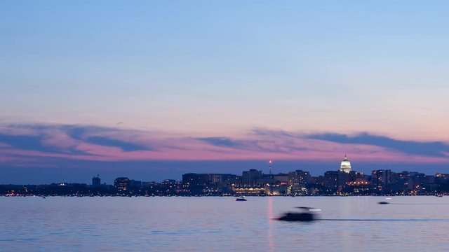 Time lapse video of sun setting and fireworks display across Lake Monona over the Madison, Wisconsin skyline 